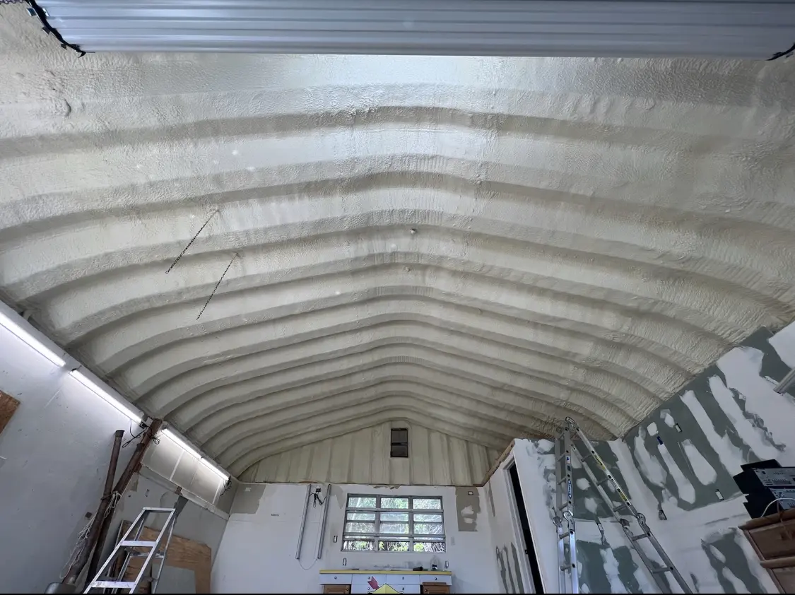 Spray polyurethane foam applied to the underside of a metal roof deck in Marlborough